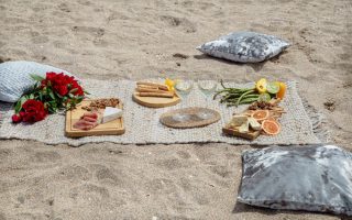 Summer beautiful romantic picnic by the sea . The concept of a holiday